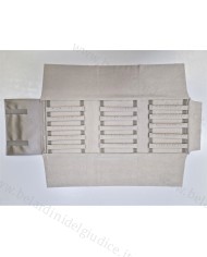 Rotolo champagne interno avorio con strisce forate per orecchini